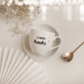 Filiżanka 100 ml espresso ze spodkiem - Czarna kawka Biały filiżanka porcelanowa nadzwyczajnie.mom ze złotym zdobieniem i napisem espresso ze spodkiem - Czarna kawka — 100 ml