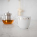 Kubek 300 ml - Parisian amour Zbliżenie na złote zdobienie na białym kubku porcelanowym Parisian amour nadzwyczajnie.mom