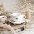 Biała filiżanka porcelanowa ze spodkiem 250 ml - złote serce z napisem dbam o swoje samopoczucie na dnie dla osoby dbającej o siebie na urodziny Filiżanka porcelanowa ze złotym sercem ze spodkiem - + dbam o swoje samopoczucie NAPIS NA DNIE nadzwyczajnie.mom — widok z