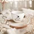 Biały kubek porcelanowy 500 ml - motyw psa i napisu jest PSIEcudownie dla miłośnika psów na urodziny Biały kubek porcelanowy nadzwyczajnie.mom ze złotym zdobieniem i napisem Jest PSIEcudownie — 500 ml